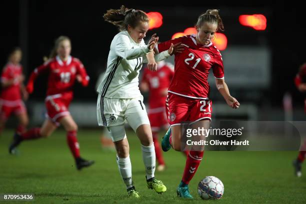 Luca von Achten of Germany and Emilie Pruesse of Denmark compete for the ball during the U16 Girls international friendly match betwwen Denmark and...