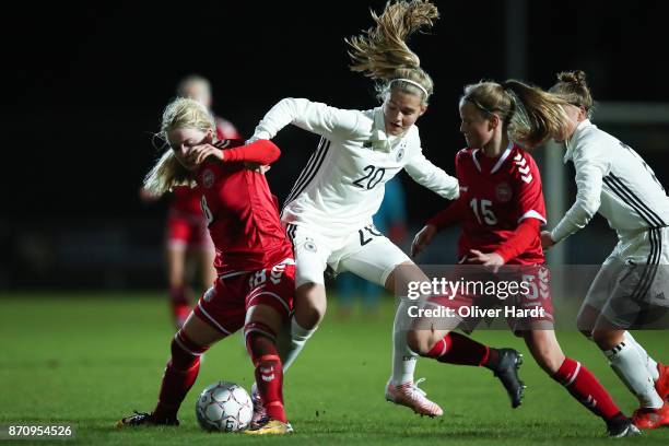 Bente Fischer of Germany and Mathilde Rasmussen of Denmark compete for the ball during the U16 Girls international friendly match betwwen Denmark and...