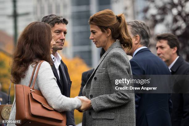 First Lady of Argentina Juliana Awada comforts mourners during a tribute for the victims of last week's vehicular attack on the bike path next to the...