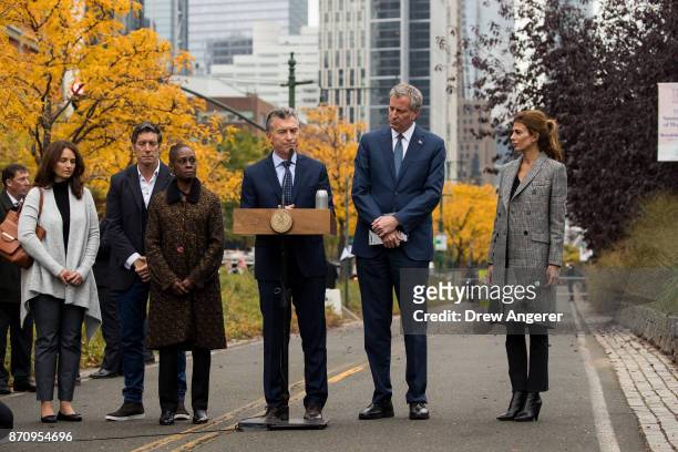 Flanked by Chirlane McCray and New York City Mayor Bill de Blasio , Argentinian President Mauricio Macri pauses while speaking during a tribute for...