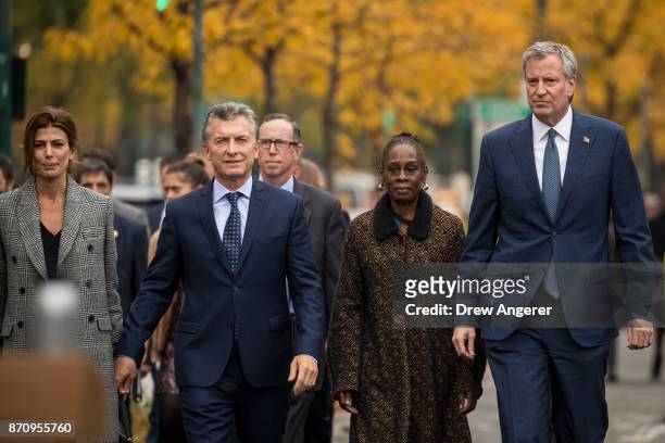 First Lady of Argentina Juliana Awada, Argentinian President Mauricio Macri, Chirlane McCray and New York City Mayor Bill de Blasio walk along a bike...