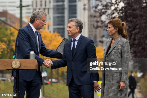 New York City Mayor Bill de Blasio shakes hands with Argentinian President Mauricio Macri as First Lady of Argentina Juliana Awada looks on during a...