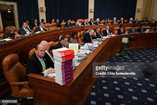 House Ways and Means Committee member Rep. Tom Reed keeps a stack of books that document the current federal tax code and related regulations on his...