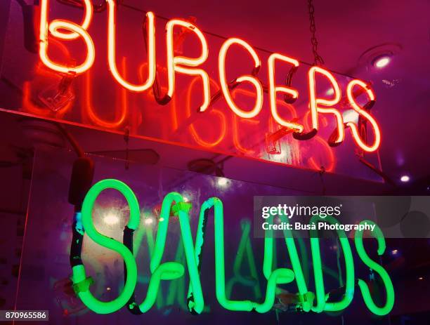 lit neon store sign of fast food joint in manhattan, at night - new york food stockfoto's en -beelden