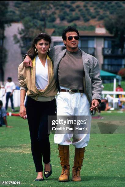 Sylvester Stallone and Jennifer Flavin walk the grounds of the Santa Barbara Polo Club, July 10, 1989 Santa Barbara Polo Club, Santa Barbara,...