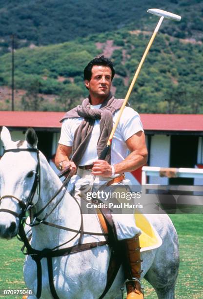 Sylvester Stallone rides a horse and prepares to play Polo at the Santa Barbara Polo Club, July 10, 1989 Santa Barbara Polo Club, Santa Barbara,...