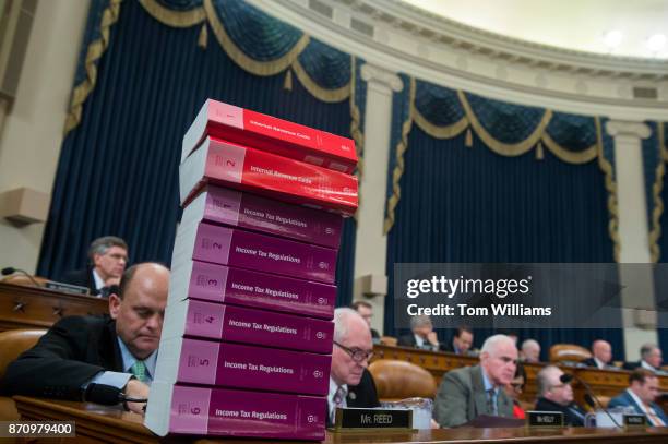 Stack of the current tax codes and regulations, sit on the dais during a House Ways and Means Committee markup of the Republicans' tax reform plan...