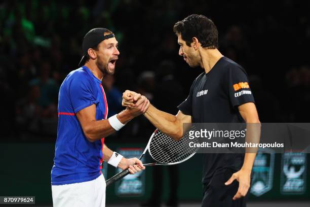 Marcelo Melo of Brazil and Lukasz Kubot of Poland celebrate match point, winning the Mens Doubles Final against Marcel Granollers of Spain and Ivan...