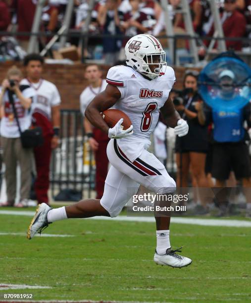 Marquis Young of the Massachusetts Minutemen carries the ball during the first half of an NCAA football game against the Mississippi State Bulldogs...