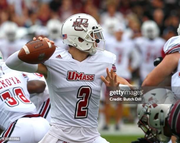 Ross Comis of the Massachusetts Minutemen throws a pass during the first half of an NCAA football game against the Mississippi State Bulldogs at...