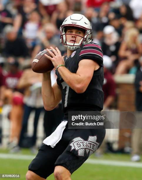 Nick Fitzgerald of the Mississippi State Bulldogs throws a pass during the first half of an NCAA football game against the Massachusetts Minutemen at...