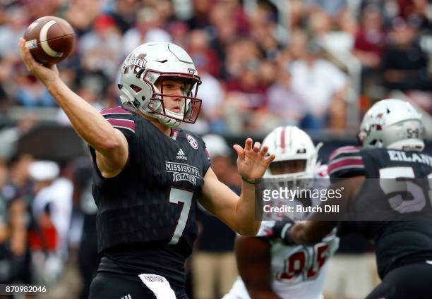 Nick Fitzgerald of the Mississippi State Bulldogs throws a pass during the first half of an NCAA football game against the Massachusetts Minutemen at...
