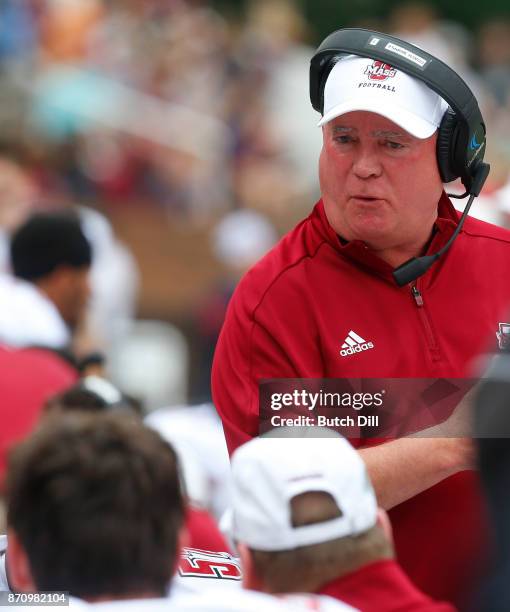 Head coach Mark Whipple of the Massachusetts Minutemen talks with players during the first half of an NCAA football game against the Mississippi...
