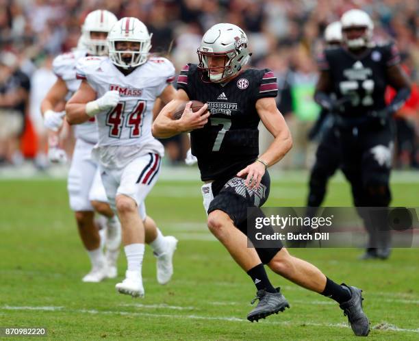 Nick Fitzgerald of the Mississippi State Bulldogs carries the ball during the first half of an NCAA football game against the Massachusetts Minutemen...