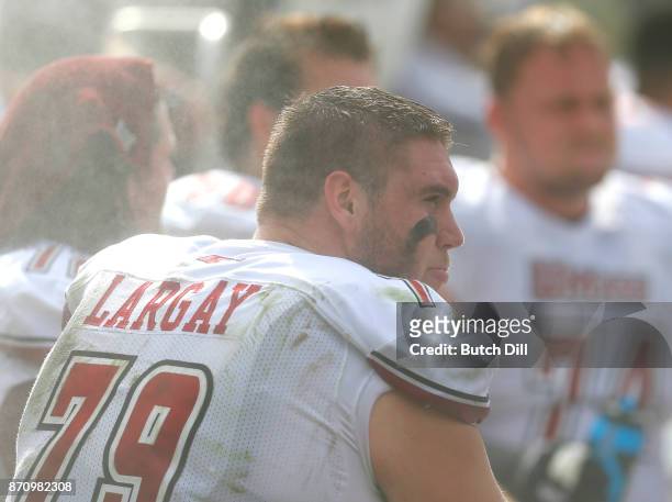 Jake Largay of the Massachusetts Minutemen sits on the bench during the first half of an NCAA football game against Mississippi State Bulldogs at...