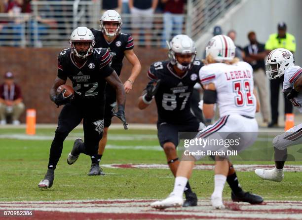 Aeris Williams of the Mississippi State Bulldogs carries the ball during the second half of an NCAA football game against the Massachusetts Minutemen...