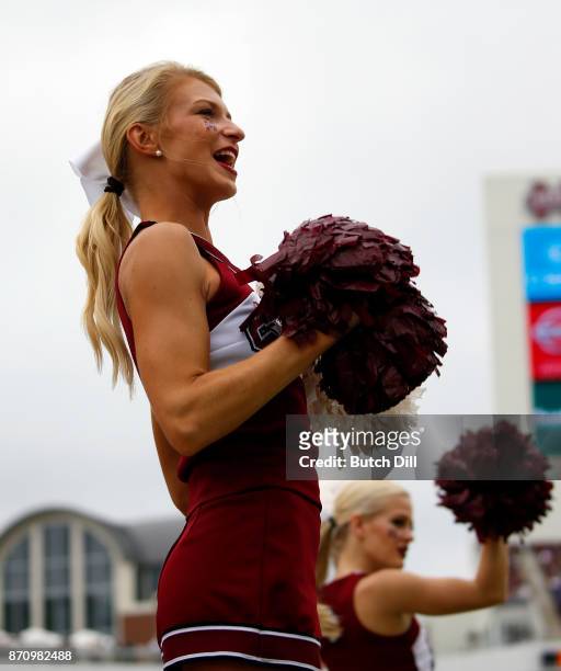 Mississippi State Bulldogs cheerleader cheers during the first half of an NCAA football game against the Massachusetts Minutemen at Davis Wade...