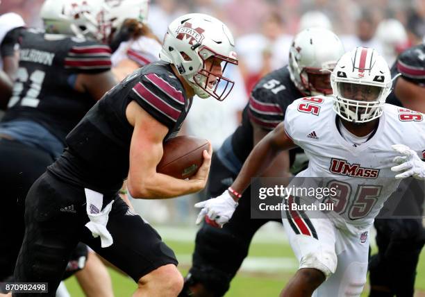 Nick Fitzgerald of the Mississippi State Bulldogs carries the ball against the Massachusetts Minutemen during the second half of an NCAA football...