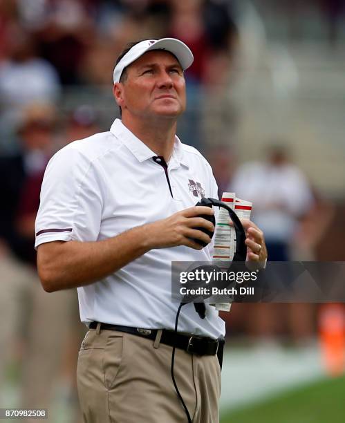 Head coach Dan Mullen of the Mississippi State Bulldogs watches a replay during the second half of an NCAA football game against the Massachusetts...