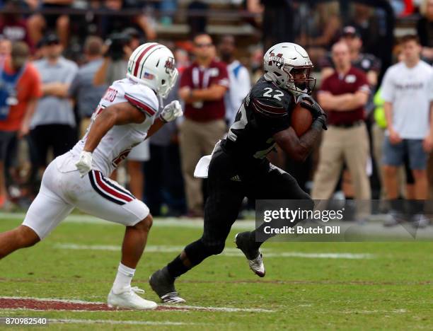 Aeris Williams of the Mississippi State Bulldogs carries the ball against the Massachusetts Minutemen during the second half of an NCAA football game...