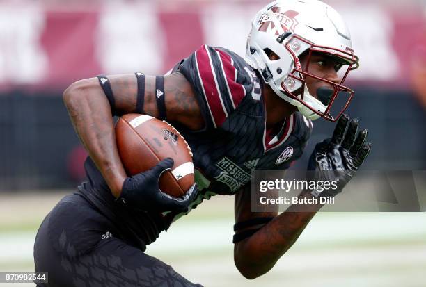 Reginald Todd of the Mississippi State Bulldogs carries the ball during the second half of an NCAA football game against the Massachusetts Minutemen...