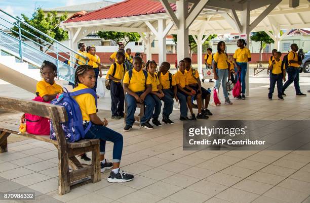 Pupils gather at The Clair Saint Maximin primary school in Grand Case, during a visit of French Prime Minister Edouard Philippe to the French...