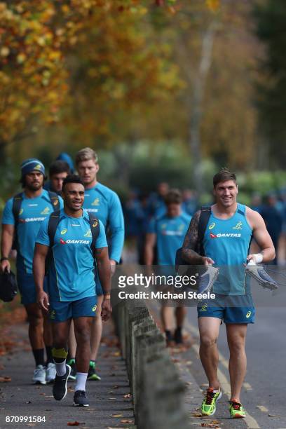 Sean McMahon and Will Genia walk towards the Australia rugby training session at Sport Wales on November 6, 2017 in Cardiff, Wales.