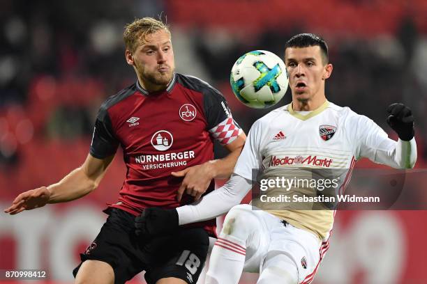 Hanno Behrens2 of 1.FC Nuernberg and Alfredo Morales of FC Ingolstadt 04 compete for the ball during the Second Bundesliga match between 1. FC...