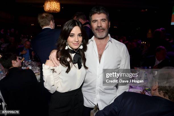 Camila Cabello and Simon Cowell pose at the 26th annual Music Industry Trust Awards held at The Grosvenor House Hotel on November 6, 2017 in London,...