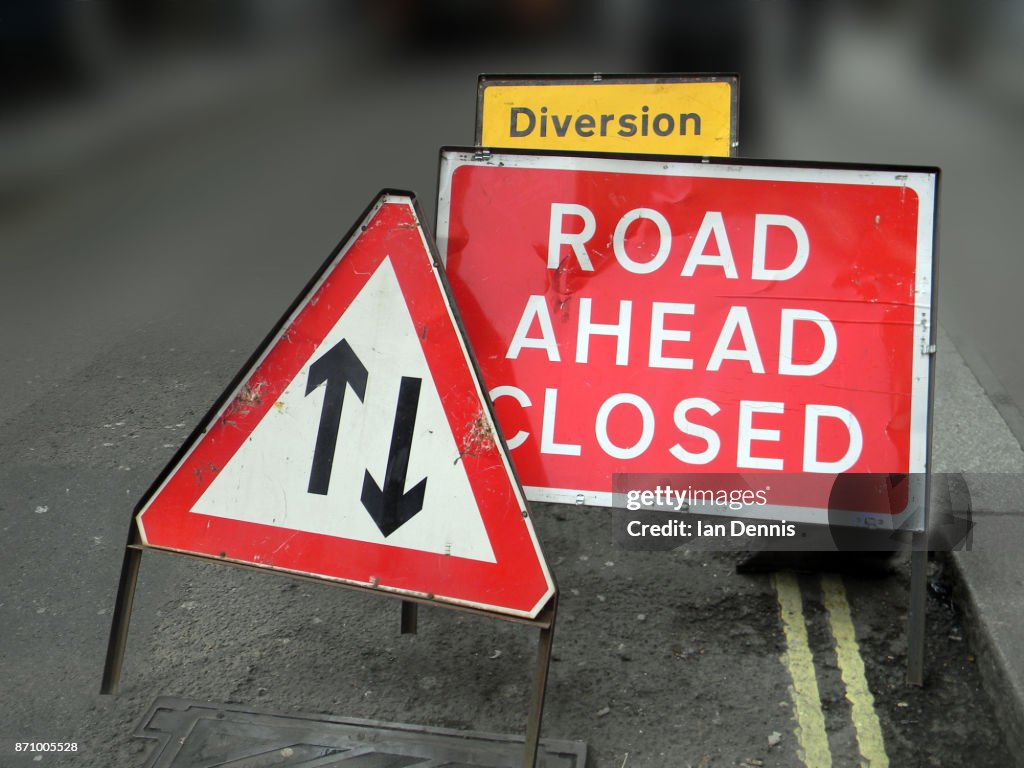 Road ahead closed sign and Two way traffic sign