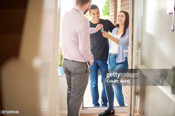 tenants receiving their property keys - rent assistance stock pictures, royalty-free photos & images