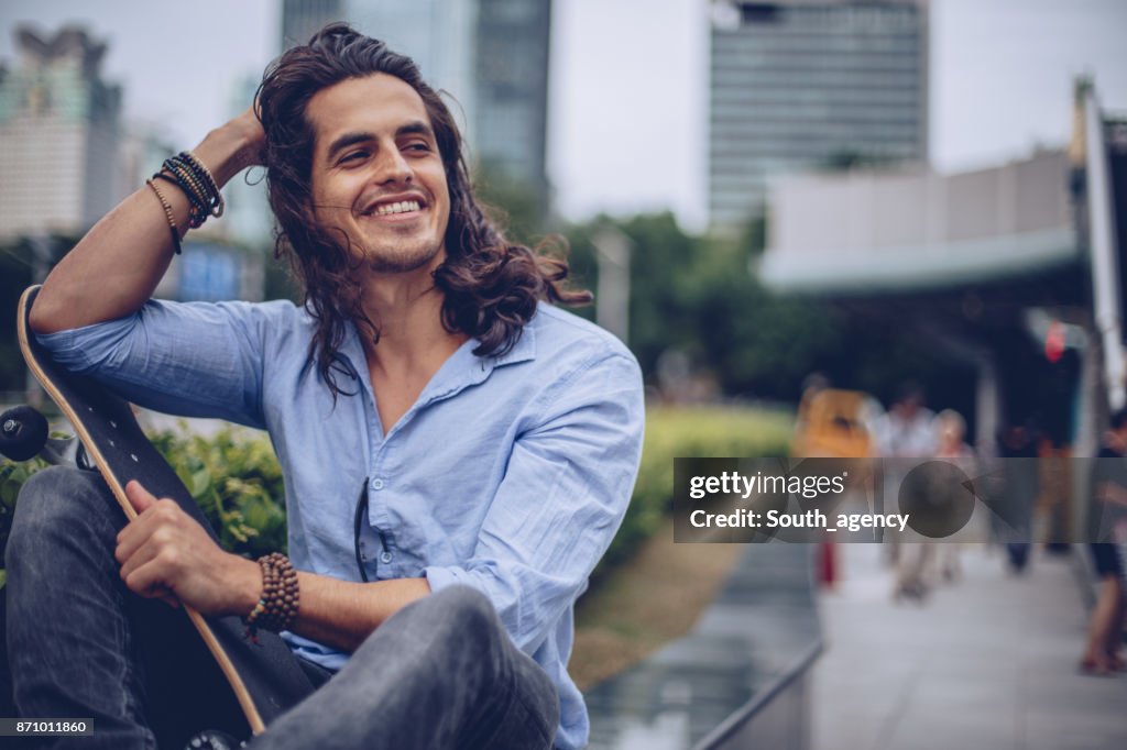 Handsome man with skateboard