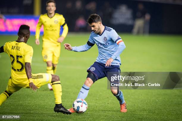 Forward and Captain David Villa tries to get past Harrison Afful of Columbus Crew during the Audi MLS Eastern Conference Semifinal Leg 2 match...
