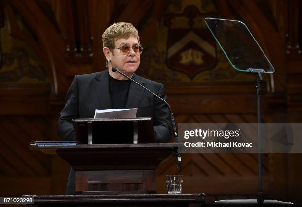 Founder Elton John accepts the Peter J. Gomes Humanitarian of the Year Award from the Harvard Foundation for his work towards ending AIDS at Memorial...