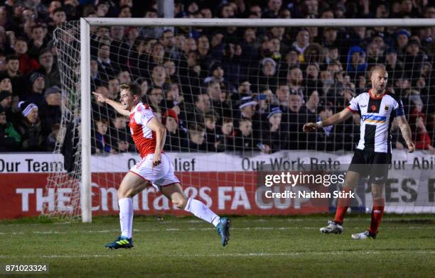 Jack Sowerby of Fleetwood Town celebrates after scoring the winner during The Emirates FA Cup First Round match between Chorley and Fleetwood Town at...