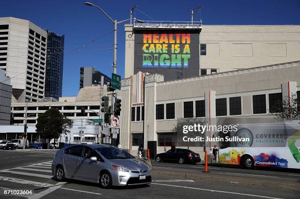 Healthcare mural by artist APEXER is displayed on the exterior of HealthRIGHT 360 on November 6, 2017 in San Francisco, California. A statewide bus...