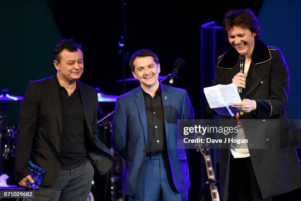 James Dean Bradfield, Sean Moore and Nicky Wire of the Manic Street Preachers speak on stage at the 26th annual Music Industry Trust Awards held at...