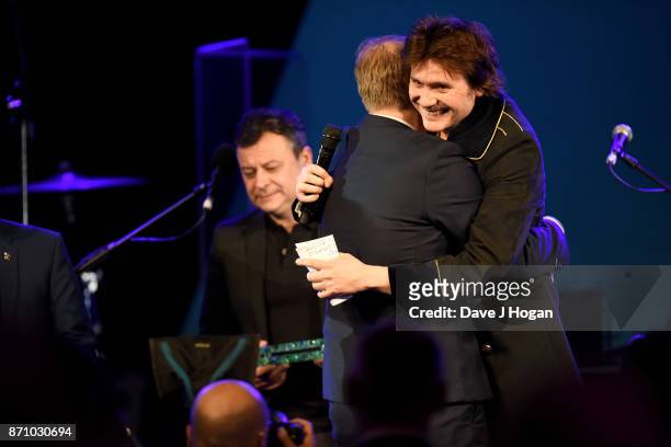 James Dean Bradfield, Rob Stringer and Nicky Wire on stage at the 26th annual Music Industry Trust Awards held at The Grosvenor House Hotel on...