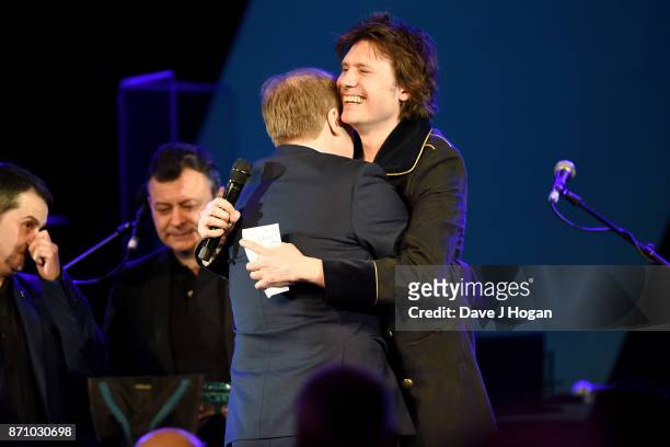 Sean Moore, James Dean Bradfield, Rob Stringer and Nicky Wire on stage at the 26th annual Music Industry Trust Awards held at The Grosvenor House...