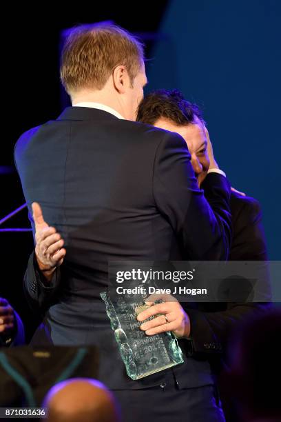 Rob Stringer and James Dean Bradfield on stage at the 26th annual Music Industry Trust Awards held at The Grosvenor House Hotel on November 6, 2017...