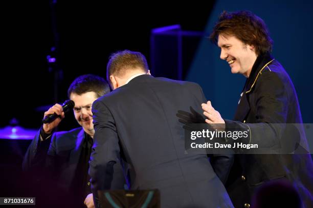 Sean Moore, Rob Stringer and Nicky Wire on stage at the 26th annual Music Industry Trust Awards held at The Grosvenor House Hotel on November 6, 2017...