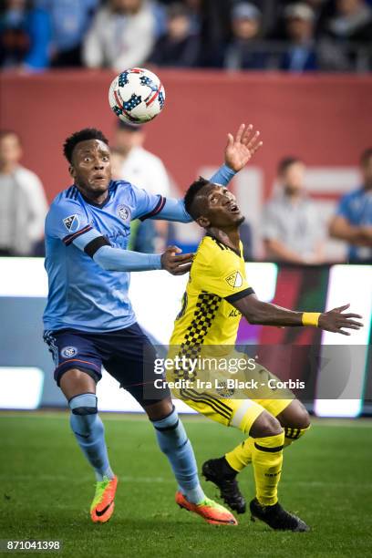 Rodney Wallace of New York City FC tries to get to the ball against Harrison Afful of Columbus Crew during the Audi MLS Eastern Conference Semifinal...