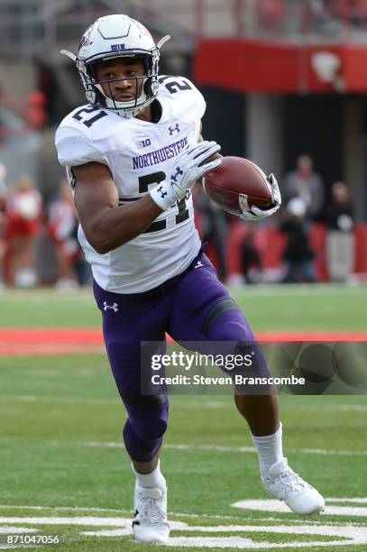 Running back Justin Jackson of the Northwestern Wildcats runs against the Nebraska Cornhuskers at Memorial Stadium on November 4, 2017 in Lincoln,...