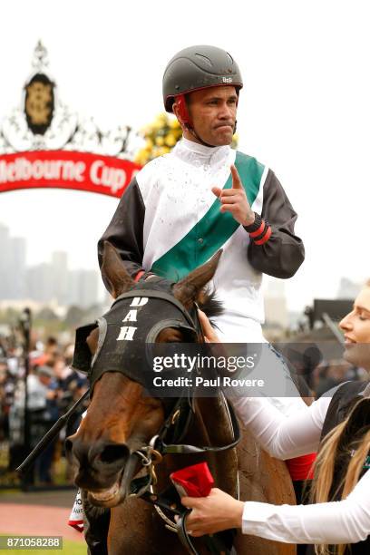 Jockey Michael Walker returns to scale on Fanatic after winning race 4, the Ronald McDonald House Charities Plate, during Melbourne Cup Day at...