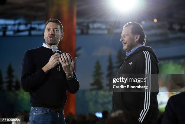 Kasper Rorsted, chief executive officer of Adidas AG, left, speaks with Marc Benioff, chairman and chief executive officer of Salesforce.com Inc.,...