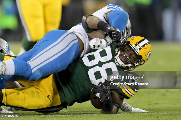 Tahir Whitehead of the Detroit Lions tackles Ty Montgomery of the Green Bay Packers in the second quarter at Lambeau Field on November 6, 2017 in...