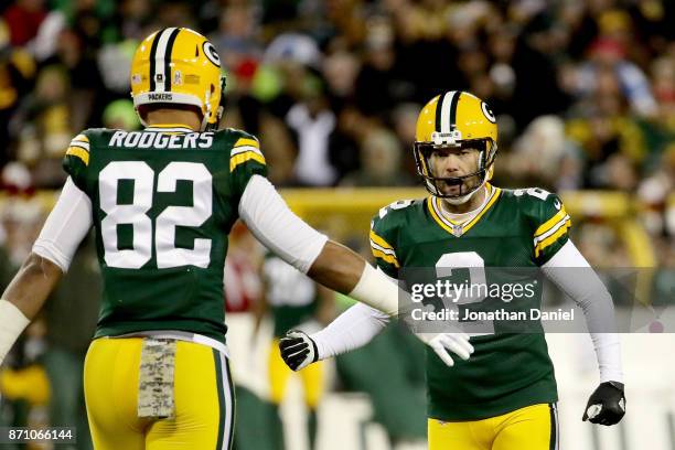 Mason Crosby and Richard Rodgers of the Green Bay Packers celebrate after Crosby kicked a field goal in the second quarter against the Detroit Lions...