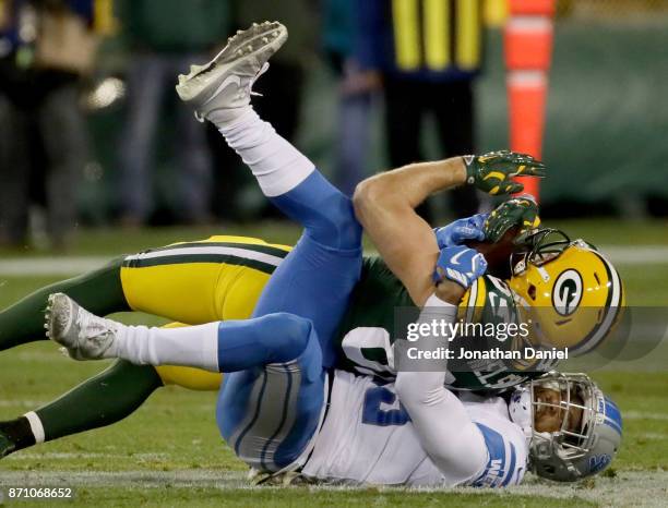 Darius Slay of the Detroit Lions tackles Jordy Nelson of the Green Bay Packers in the second quarter at Lambeau Field on November 6, 2017 in Green...