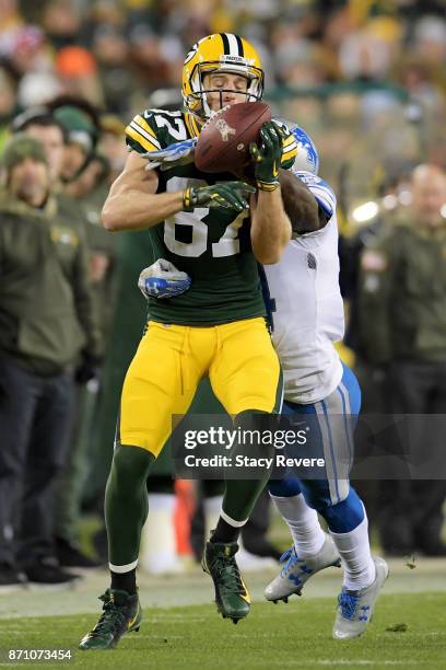 Jordy Nelson of the Green Bay Packers makes a catch while being guarded by Nevin Lawson of the Detroit Lions in the third quarter at Lambeau Field on...