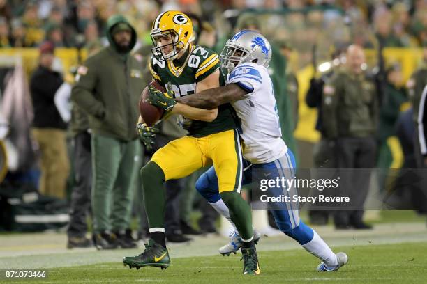 Jordy Nelson of the Green Bay Packers makes a catch while being guarded by Nevin Lawson of the Detroit Lions in the third quarter at Lambeau Field on...